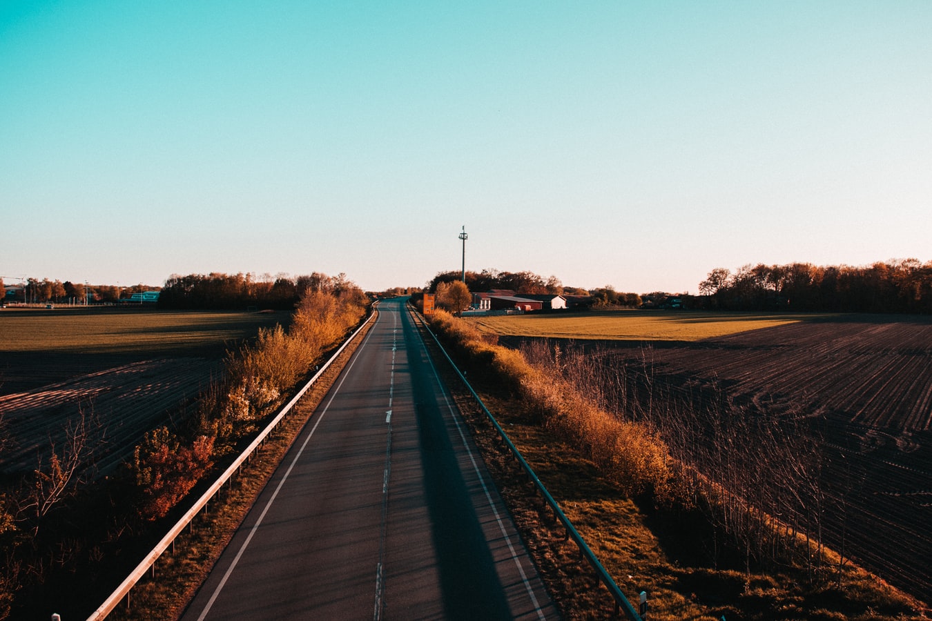 Scenic Road Through Open Countryside at Dusk