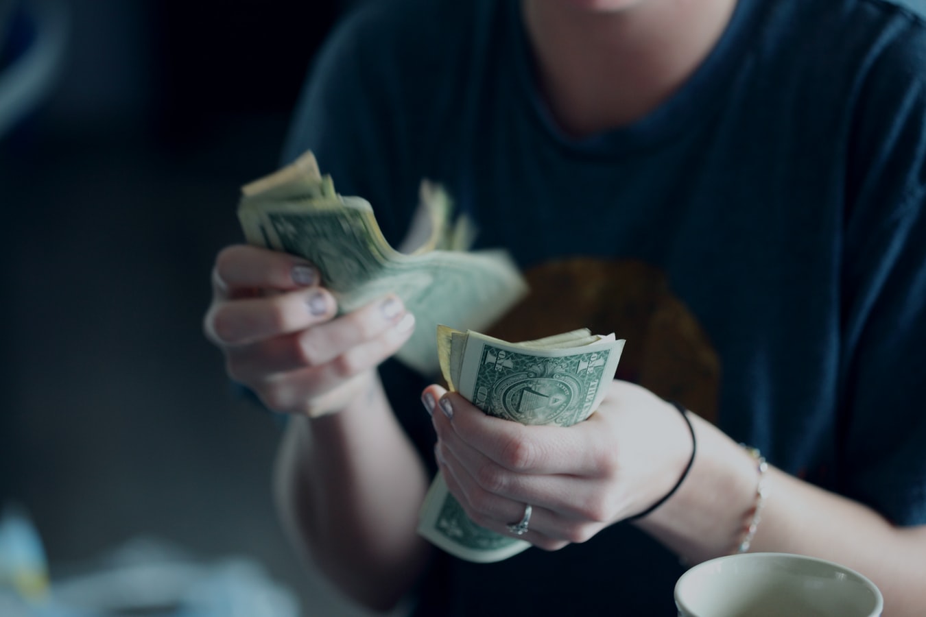 A Girl Counting Currency
