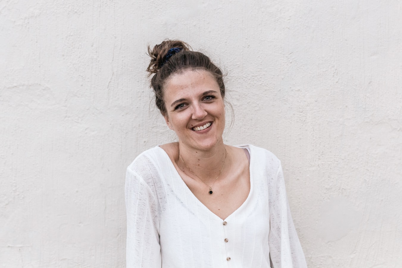 Young Woman in a White Shirt Smiling